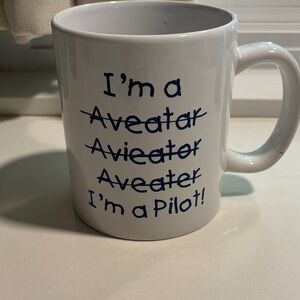 White Ceramic Mug with Blue Text